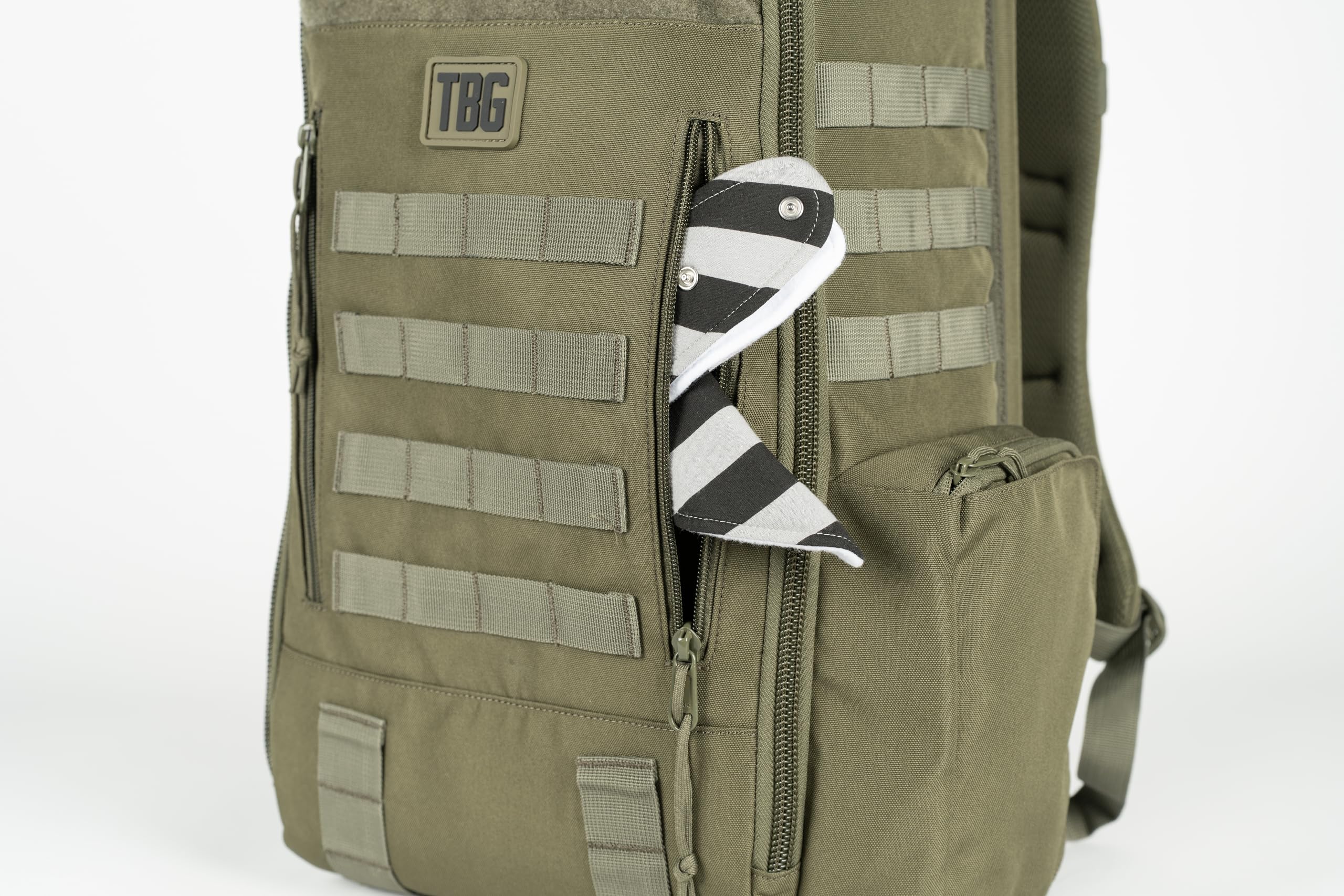 Tactical Baby Gear Daypack interior compartments organize wipes, bottles, and gear.