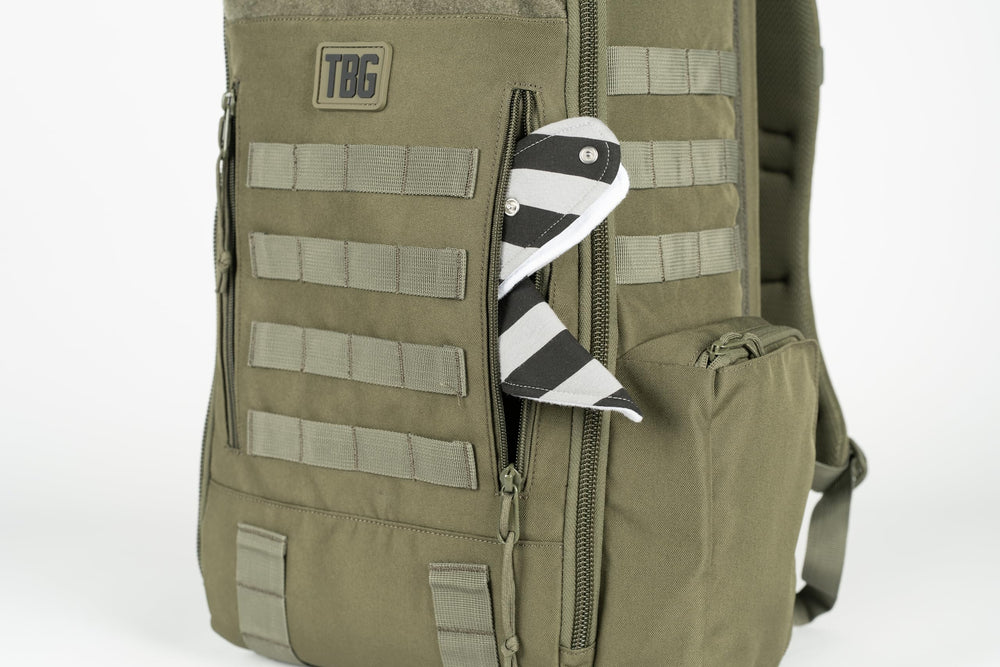 Tactical Baby Gear Daypack interior compartments organize wipes, bottles, and gear.