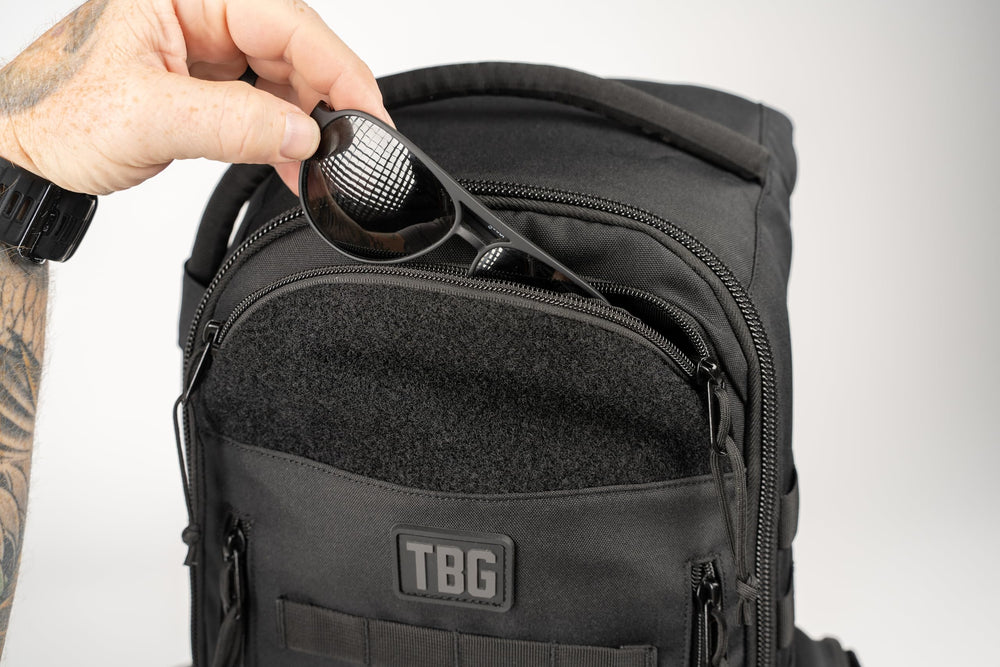 Tactical Baby Gear Daypack wipes pocket shows convenient on-the-go hygiene storage.