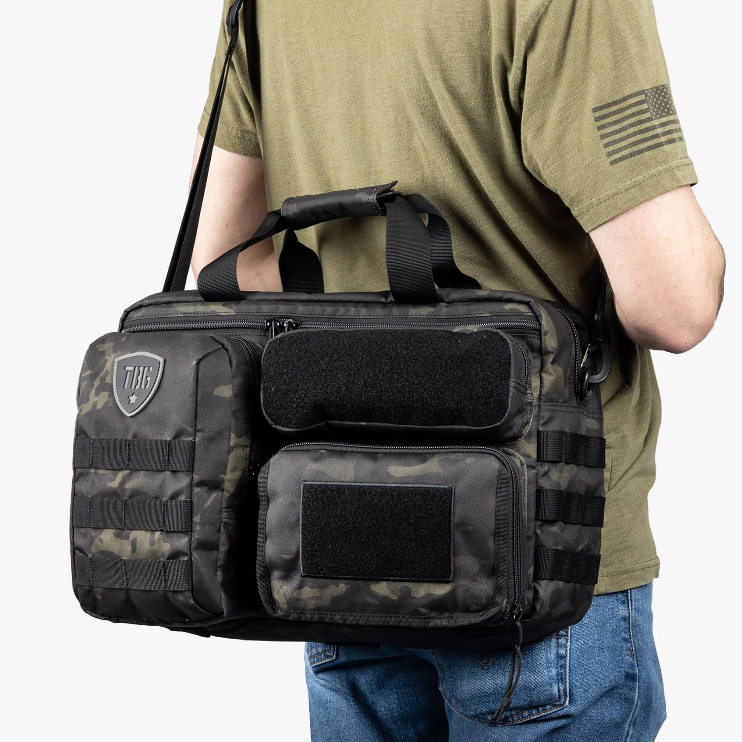 Tactical Baby Gear Deuce Diaper Bag water-resistant fabric protects essentials during rain.