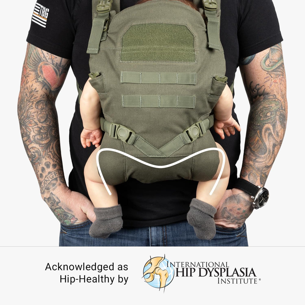 Tactical Baby Gear carrier shows UTX buckles for easy adjustment as baby grows.