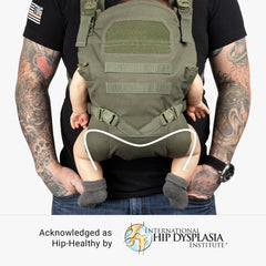 Tactical Baby Gear carrier shows UTX buckles for easy adjustment as baby grows.