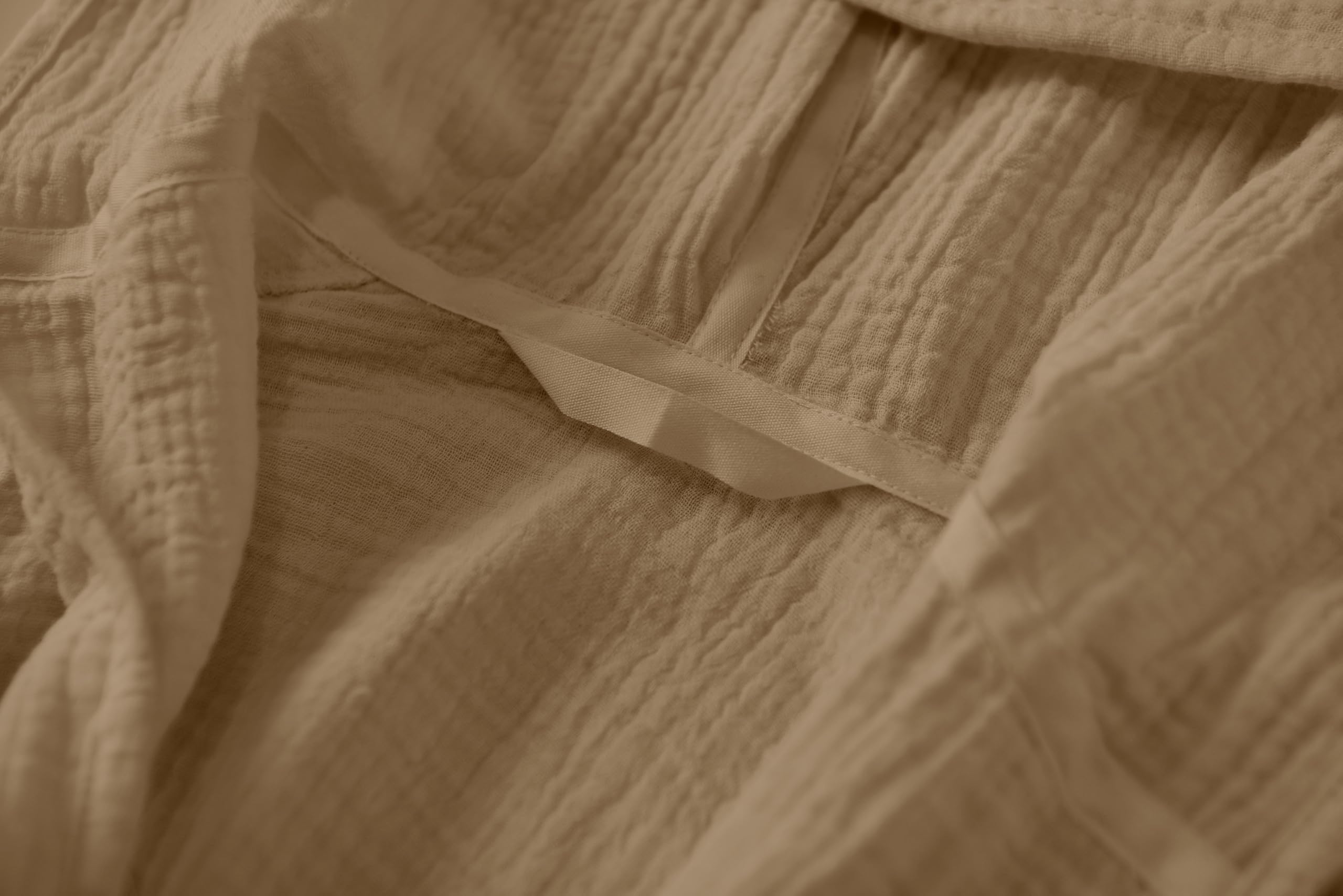 TADO MUSLIN bathrobe care shot demonstrates quick drying with machine wash capability