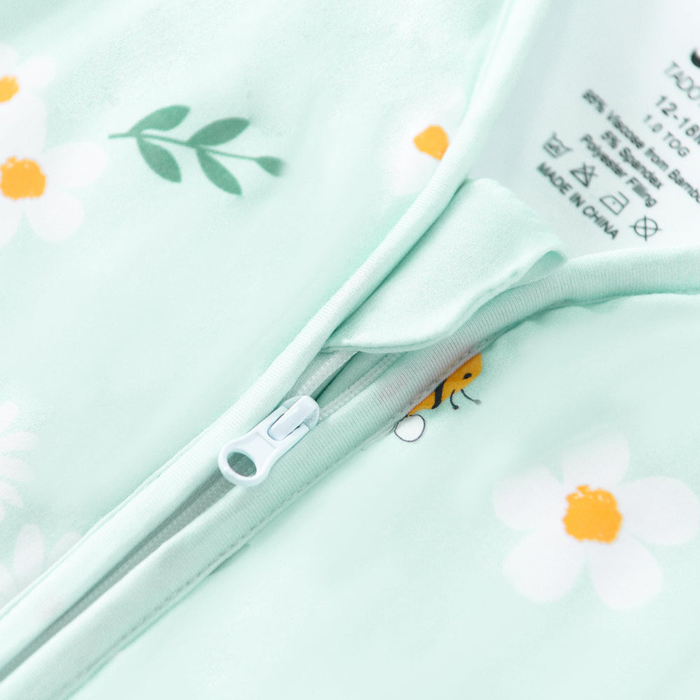 TADO MUSLIN sleep sack care tag shows machine-washable convenience.
