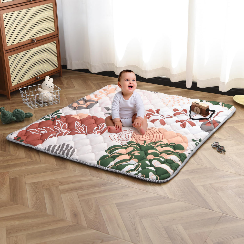 TADO MUSLIN play mat non-slip bottom keeps little movers secure on hard floors.