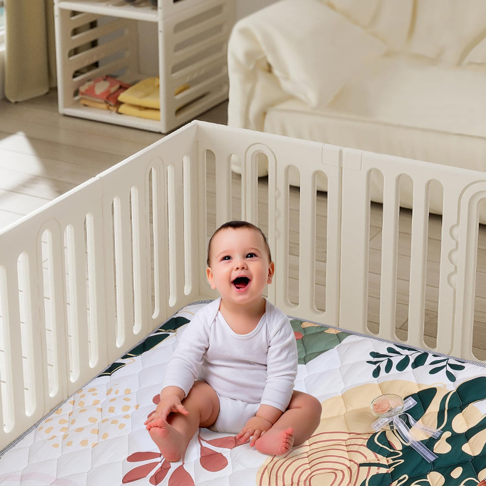 TADO MUSLIN whale-print play mat brightens rooms while encouraging crawling play.