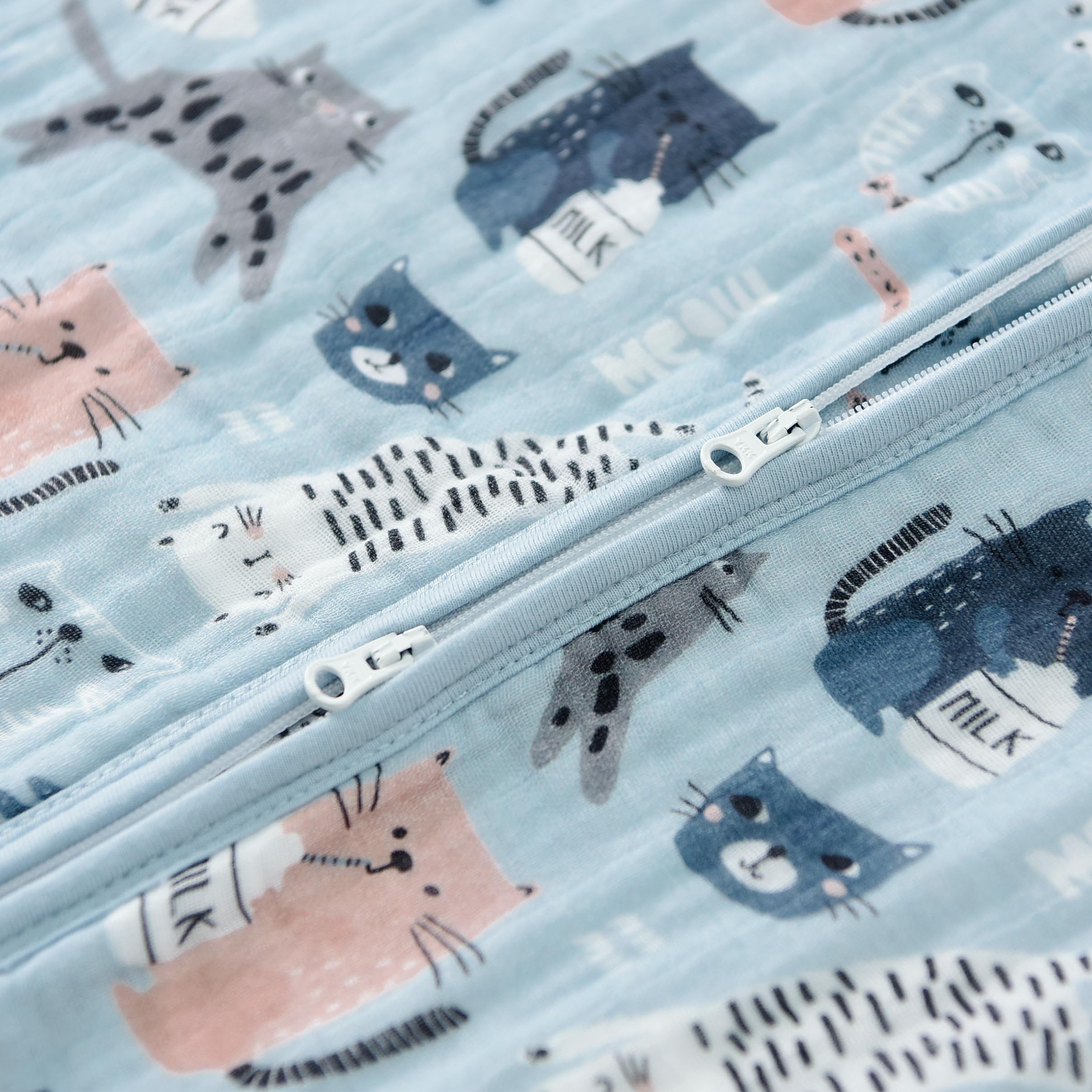 TADO MUSLIN baby wearing sack on crib demonstrates roomy design for movement