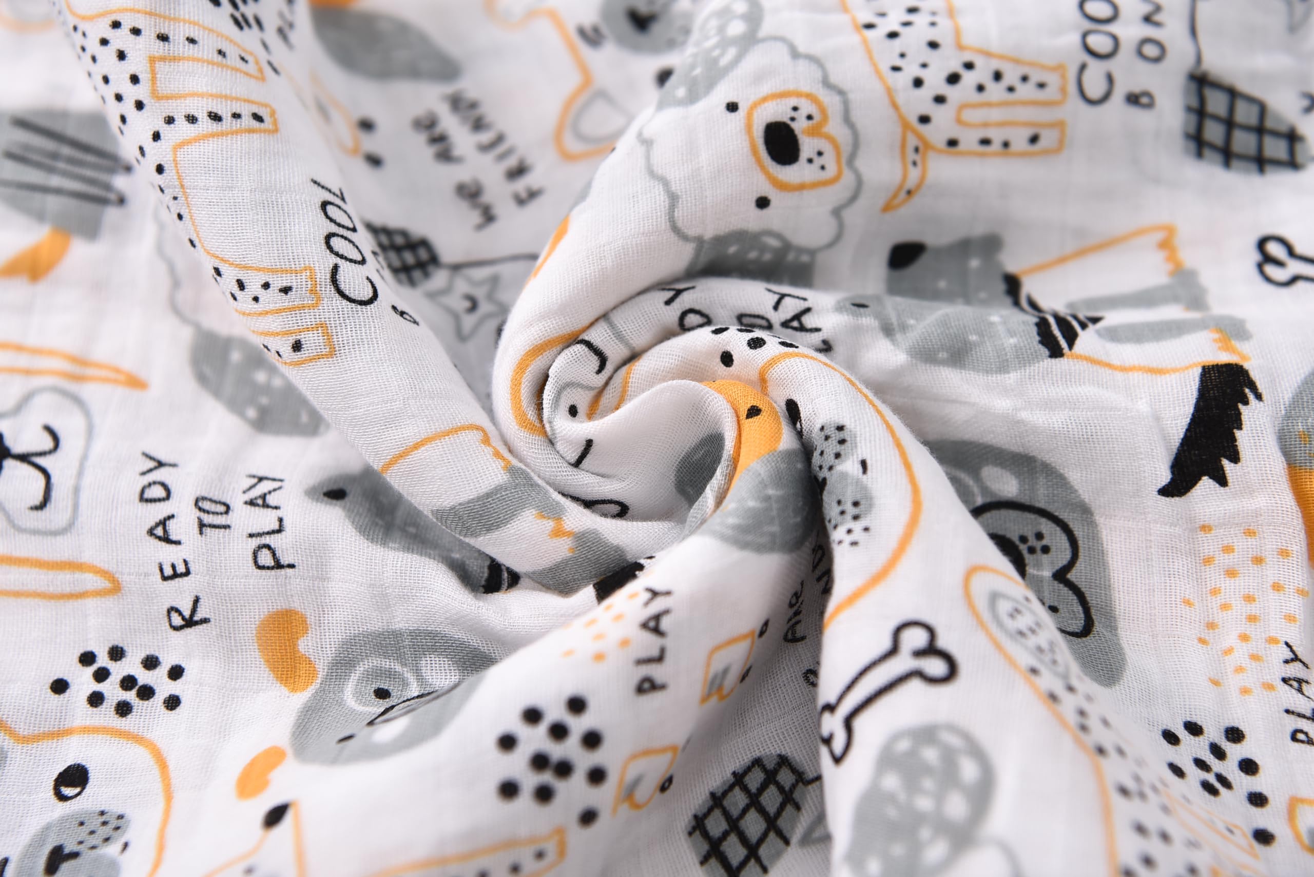 TADO MUSLIN swaddle blanket closeup-soft-texture highlights breathable organic cotton against baby's skin.