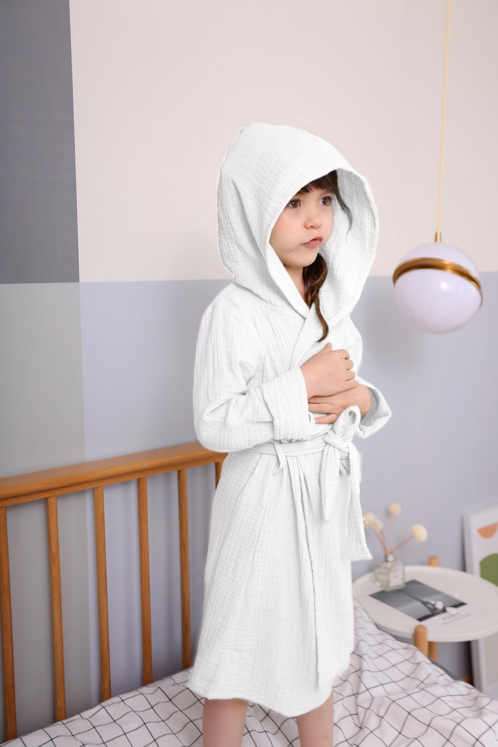 TADO MUSLIN bathrobe hanging neatly, highlighting pre-shrunk fabric quality.