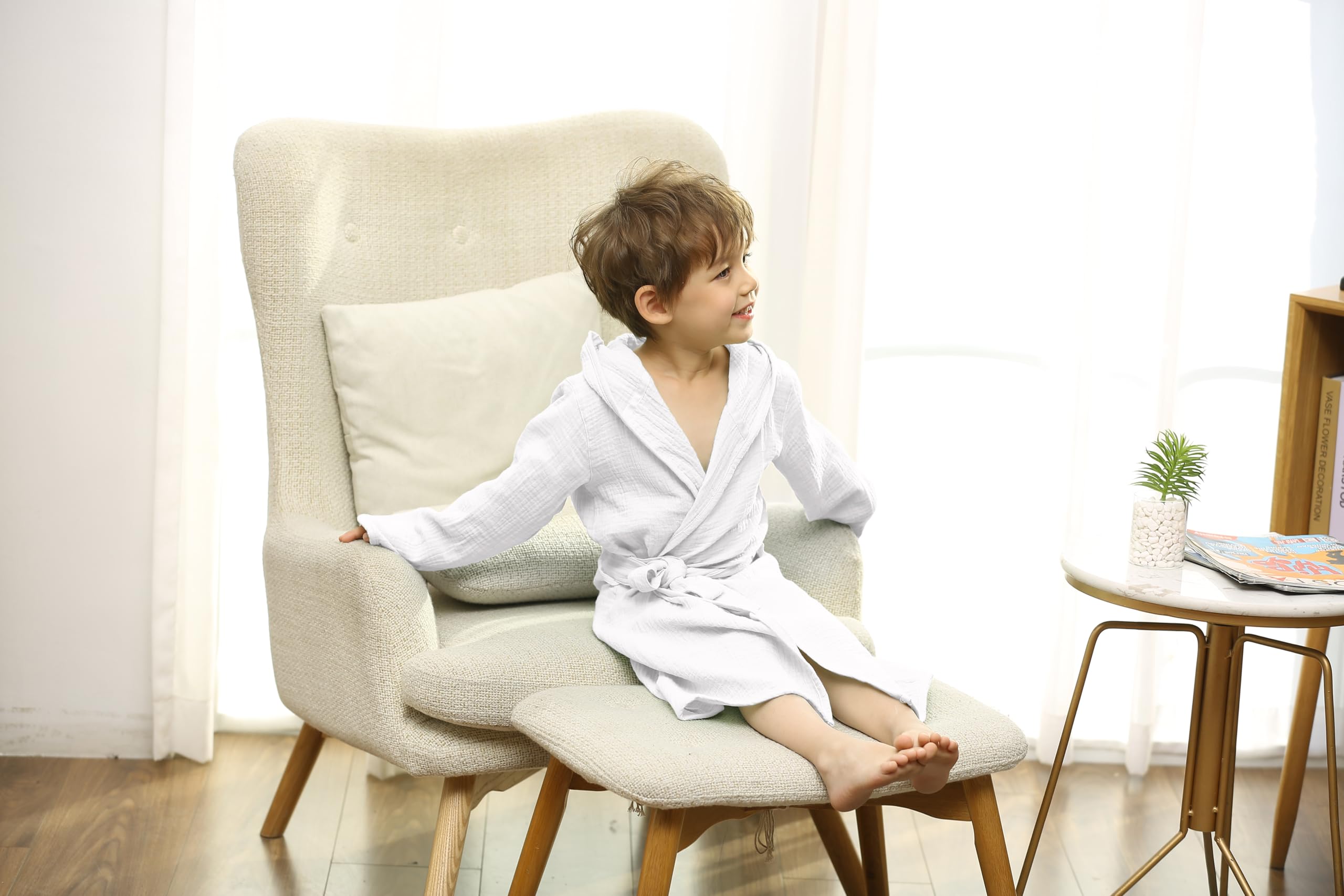 TADO MUSLIN hooded towel front view in white, adds warmth after bath time.