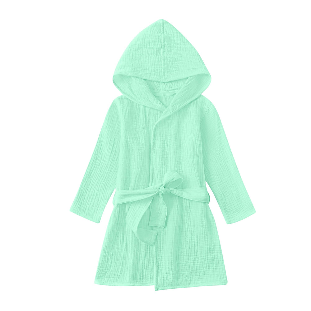 The TADO MUSLIN toddler bathrobe mint green folded for compact, soft comfort.