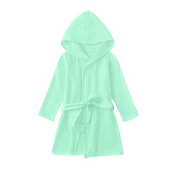 The TADO MUSLIN toddler bathrobe mint green folded for compact, soft comfort.