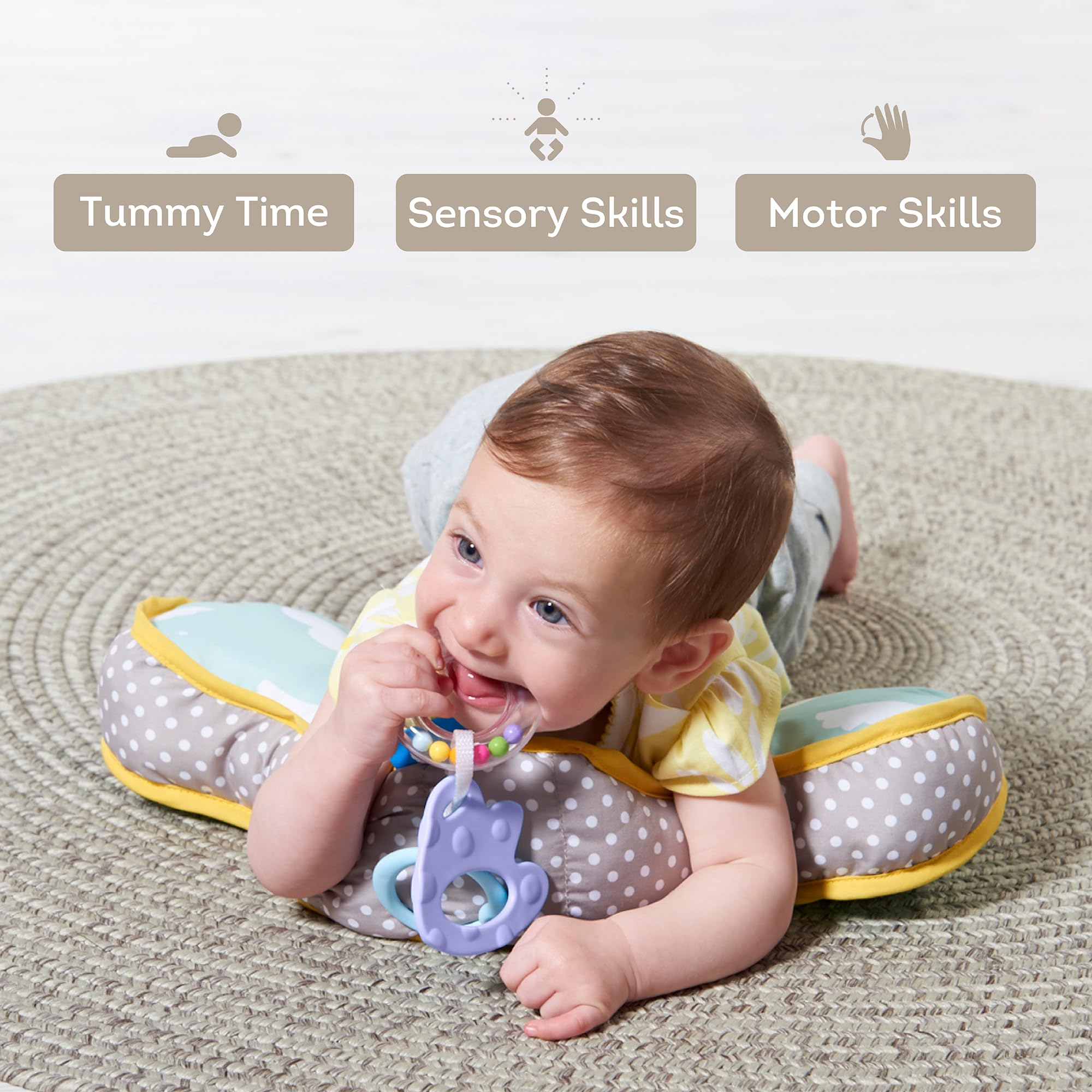 Taf Toys teether closeup shows attached toys for baby engagement.