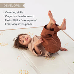 Taf Toys Fold 'n Fun Mat reversible bloom-pattern engages baby with colorful visuals.
