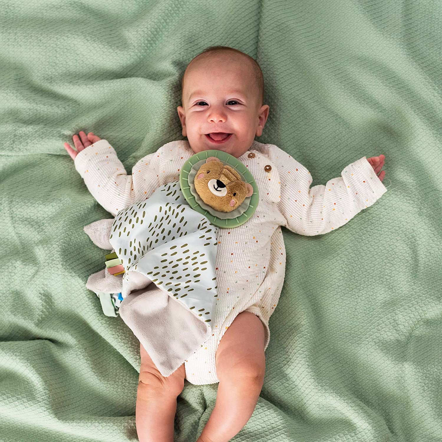 Taf Toys pacifier strap feature keeps a soother handy for on-demand comfort