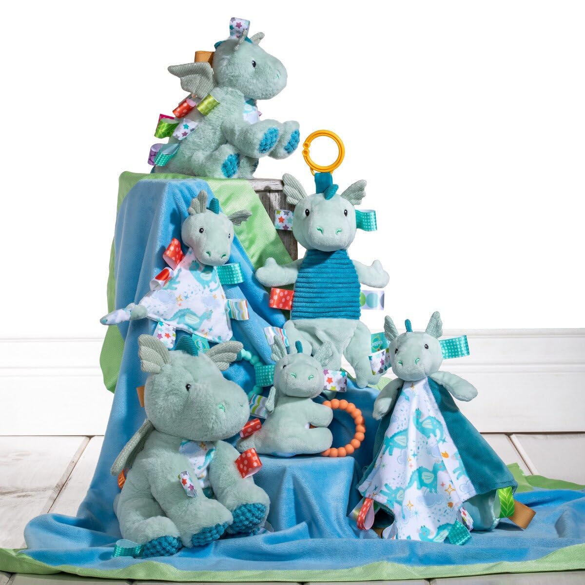 Taggies Drax Dragon portable toy in stroller for on-the-go engagement