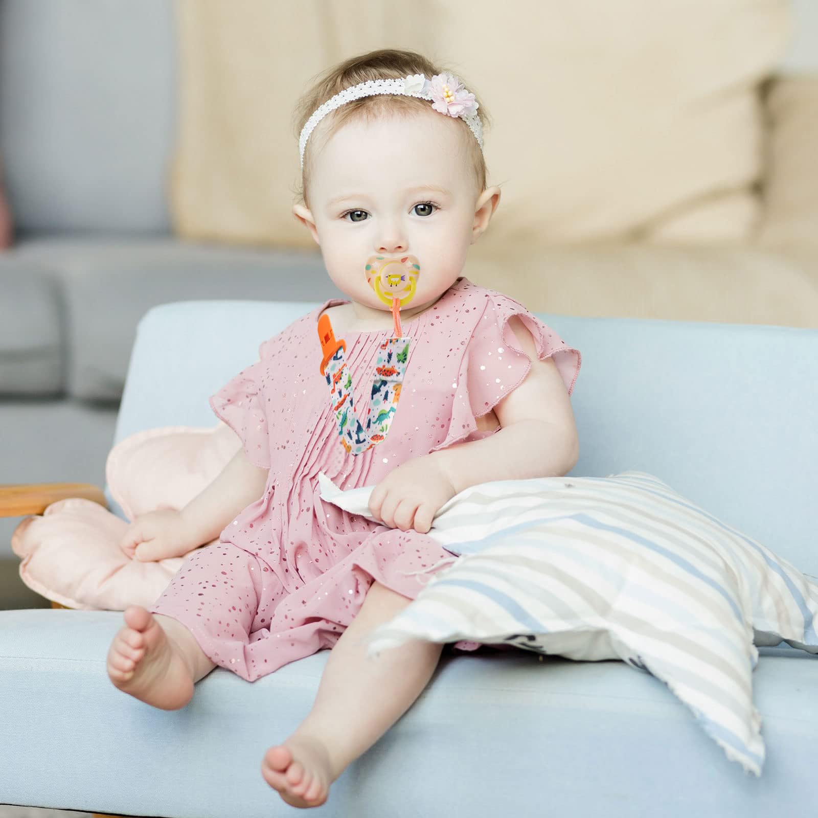 Tamhoo pacifier clips with rainbows add color and grip for outings.