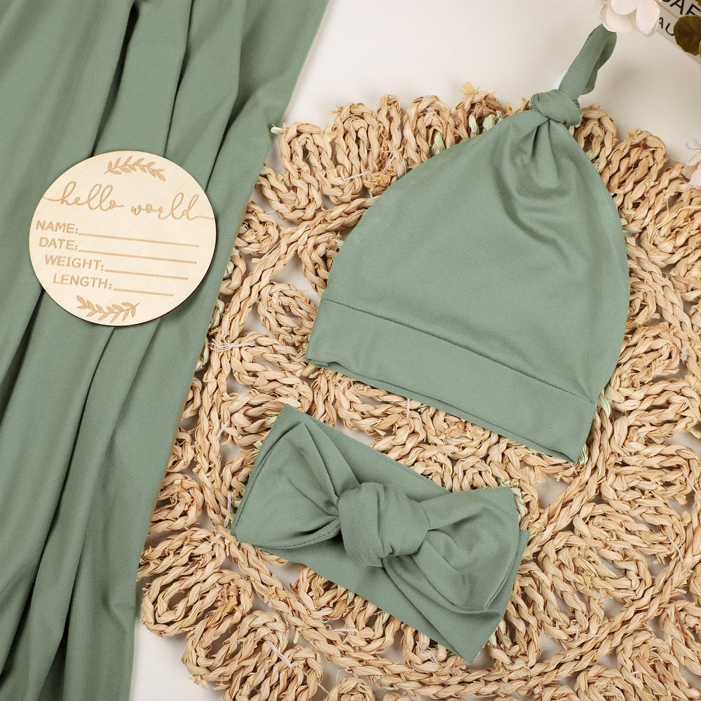 TANOFAR swaddle green headband model demonstrates stretchy fit for secure, cozy wear