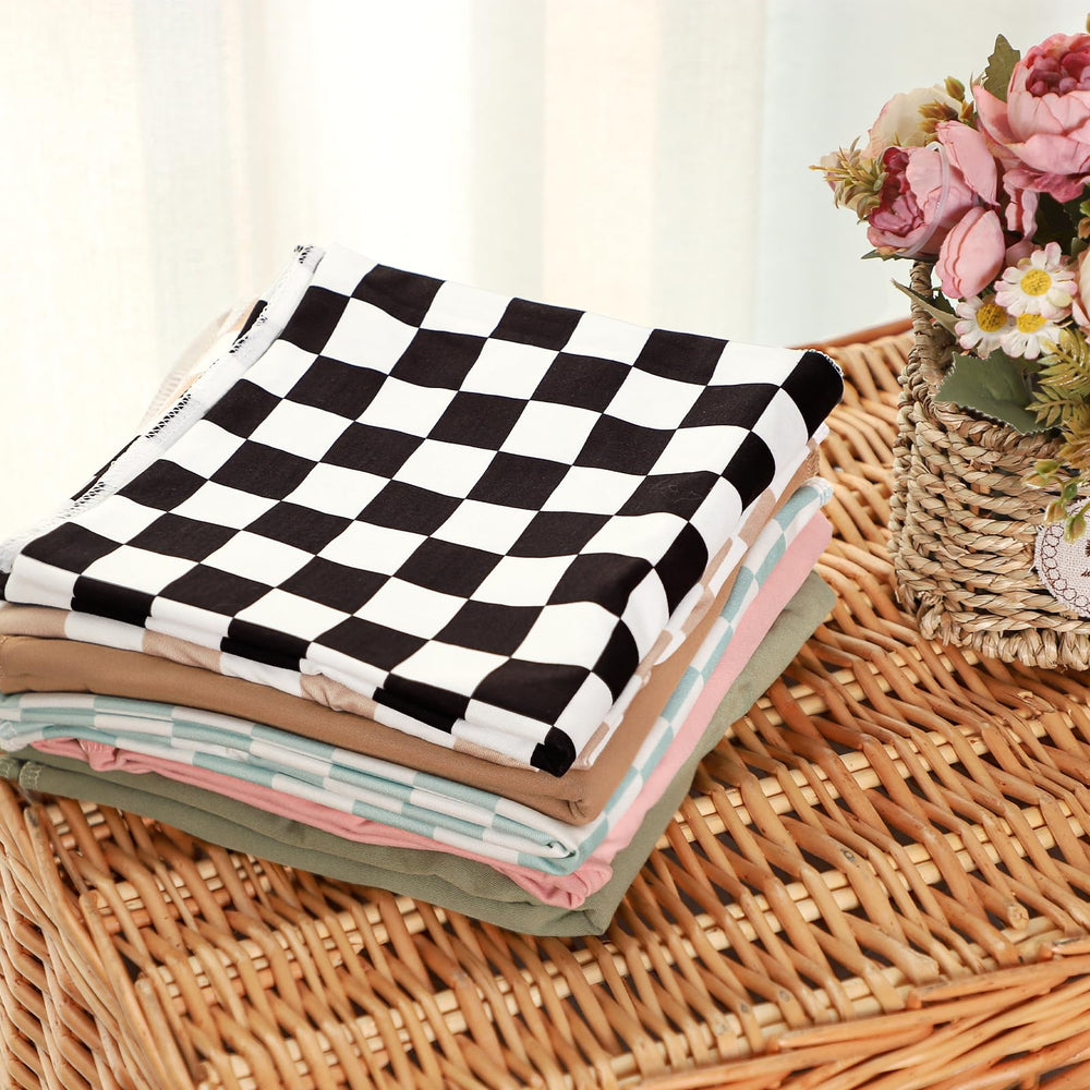 TANOFAR swaddle used as a nursery prop for candid moments.