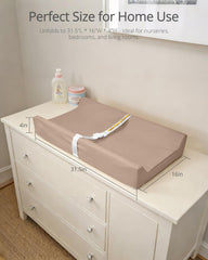 TAOCI changing pad features safety strap and raised sidewalls for added baby security during diapering.