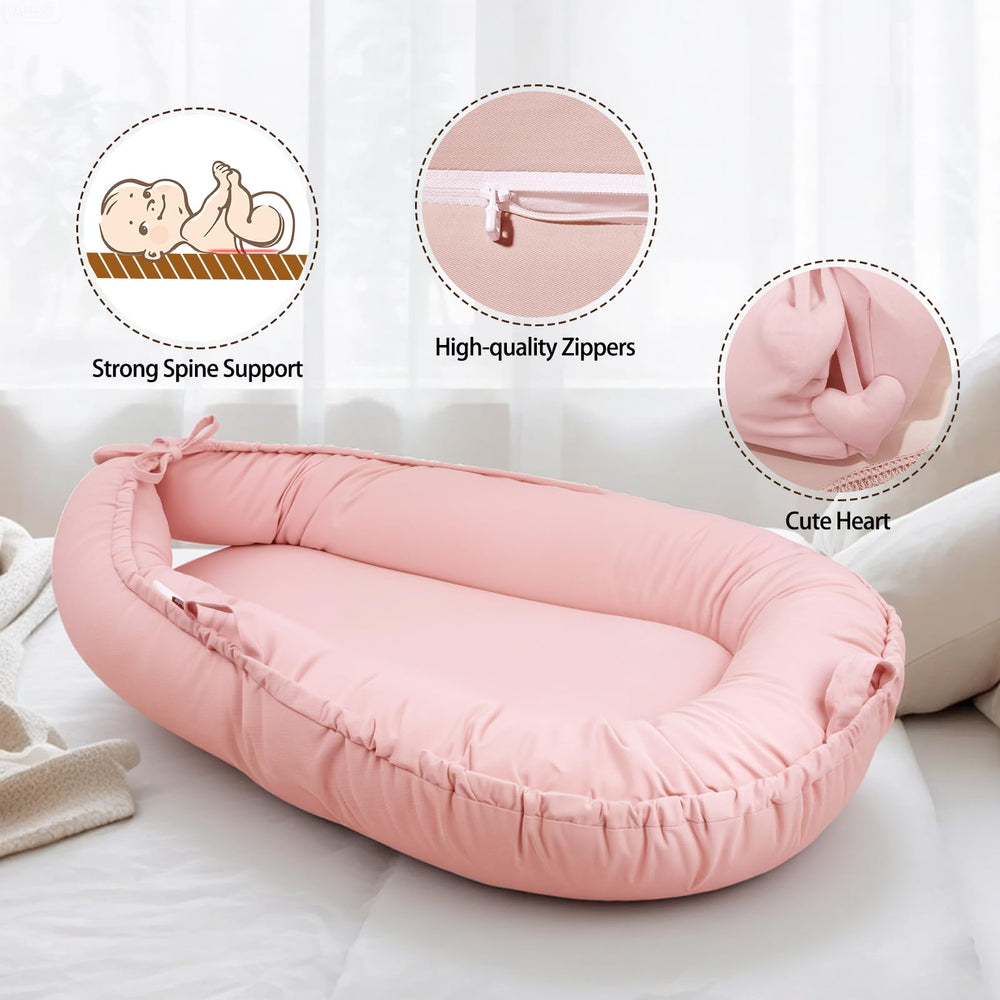 TARJODGY baby lounger shown in a stylish pink nursery setup for peaceful supervised rest.