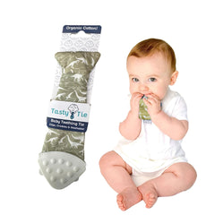 Tasty Tie teething tie in dino style with clip-on design for gum soothing.