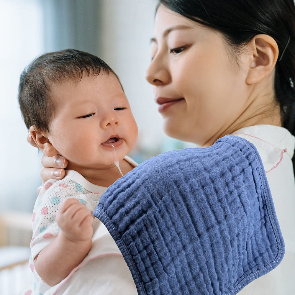 Tatuo baby muslin burp cloth on a baby during feeding.