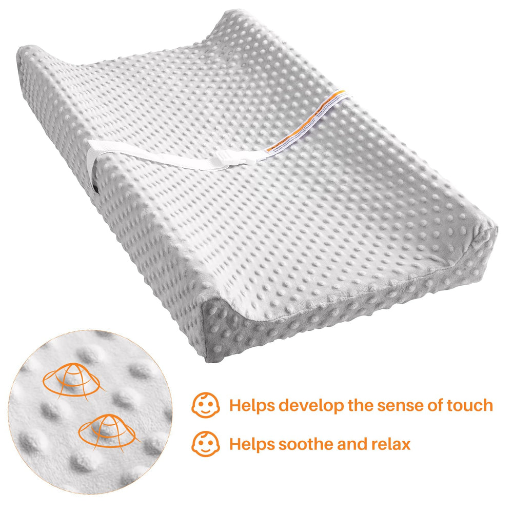 tauuio changing pad anti-roll sides illustrate added stability for newborn comfort.