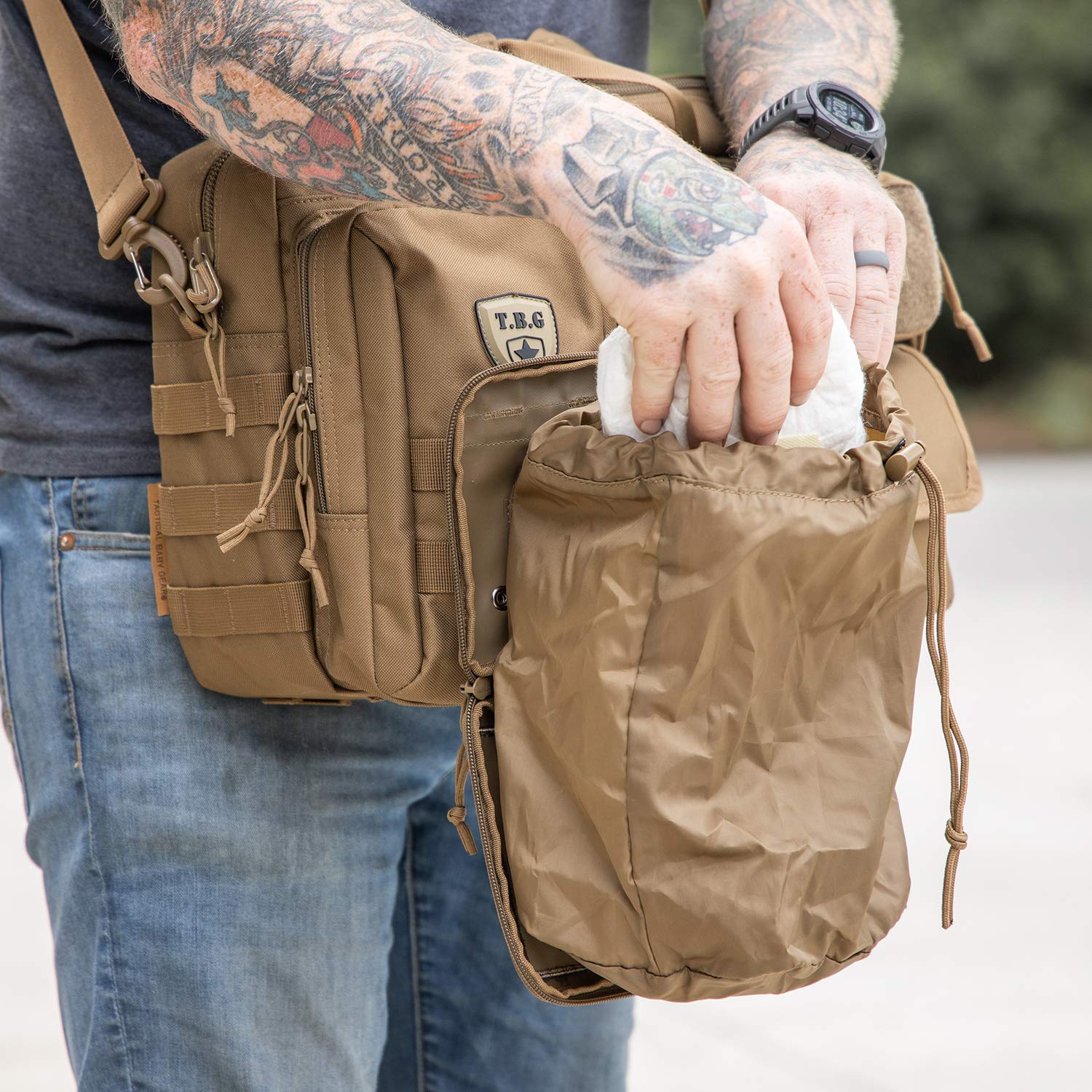 Compact dimensions of the TBG Dirty Diaper Dump Pouch open wide for easier changes