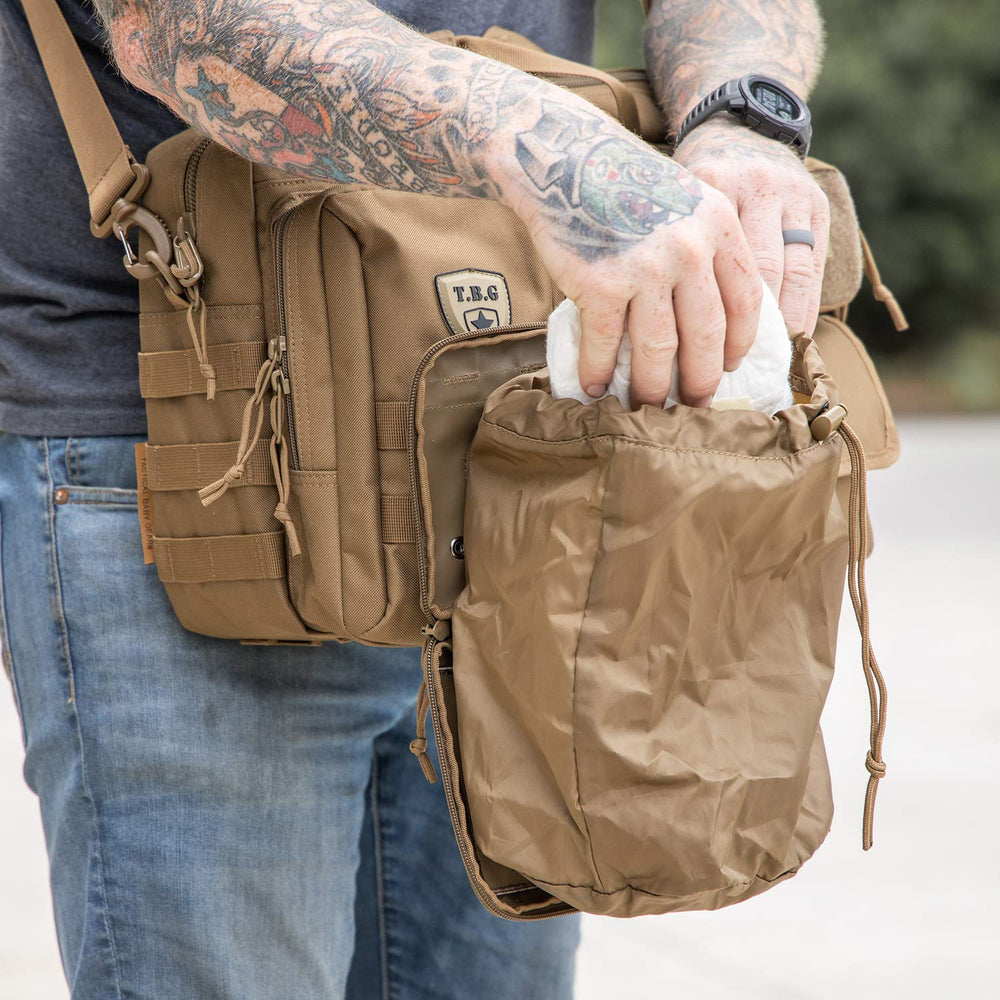 Compact dimensions of the TBG Dirty Diaper Dump Pouch open wide for easier changes