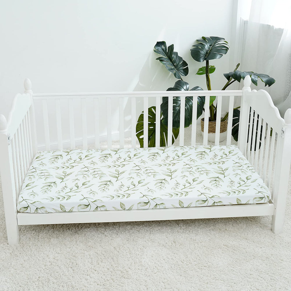 TCBunny baby-crib mattress-fit visual confirms standard 28x52 sizing.