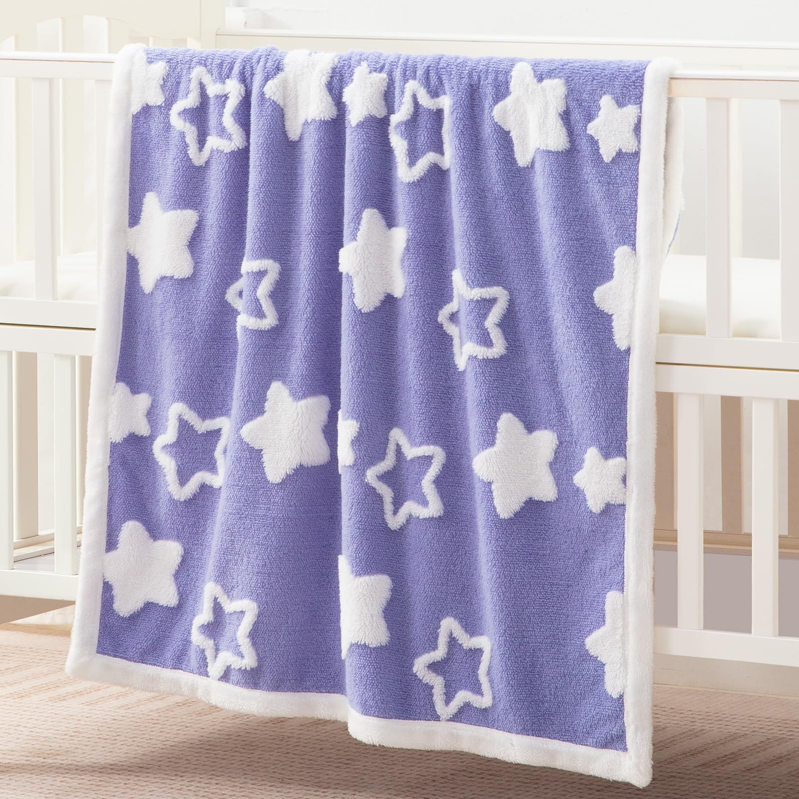 TCOYIWL baby blanket reversible design displayed for dual looks in the nursery.