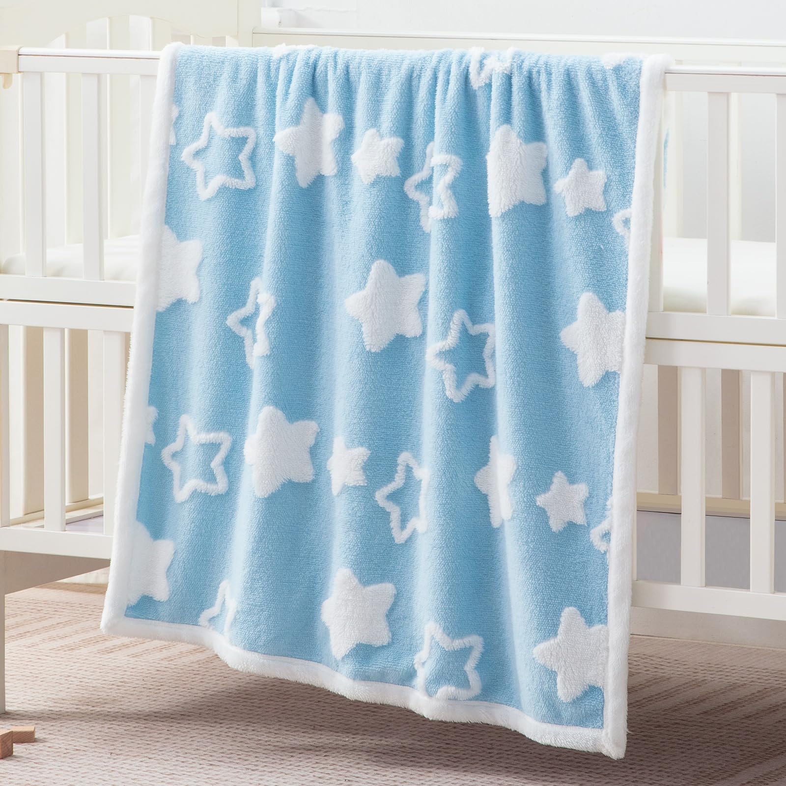 TCOYIWL baby blanket ultra-soft fleece texture for gentle warmth.