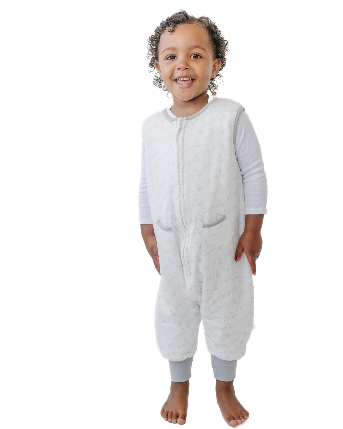 Tealbee Dreamsuit sleep sack with feet in crib showing warmth and safety