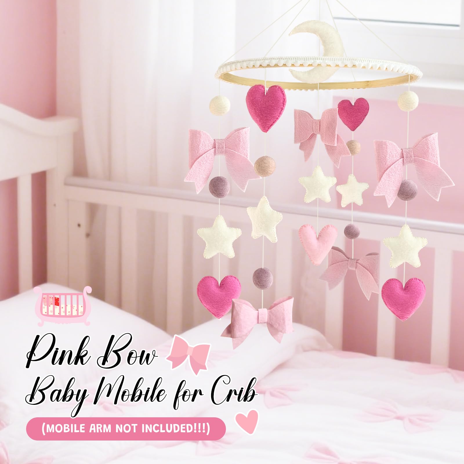Teeloray pink mobile serves as a charming newborn photo prop in girls' room.