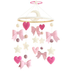 Teeloray pink bow mobile crib focal point for a baby girl's nursery.