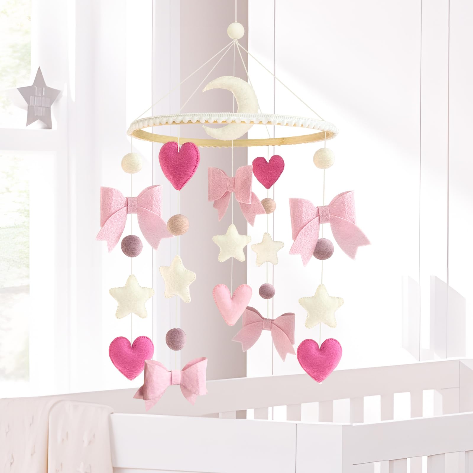 Teeloray wooden-top mobile with natural ring adds warmth to crib decor.