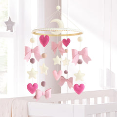 Teeloray wooden-top mobile with natural ring adds warmth to crib decor.