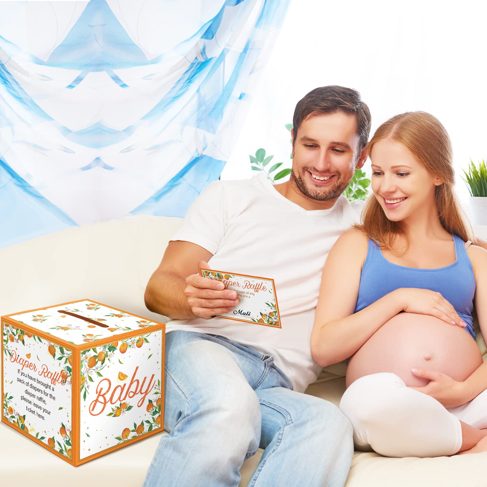 Teling baby shower setup idea featuring box and tickets for organizers.