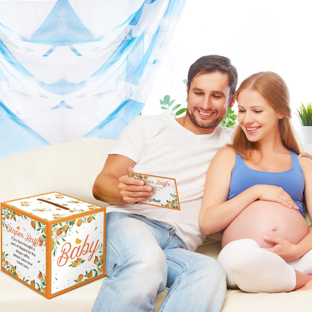 Teling baby shower setup idea featuring box and tickets for organizers.