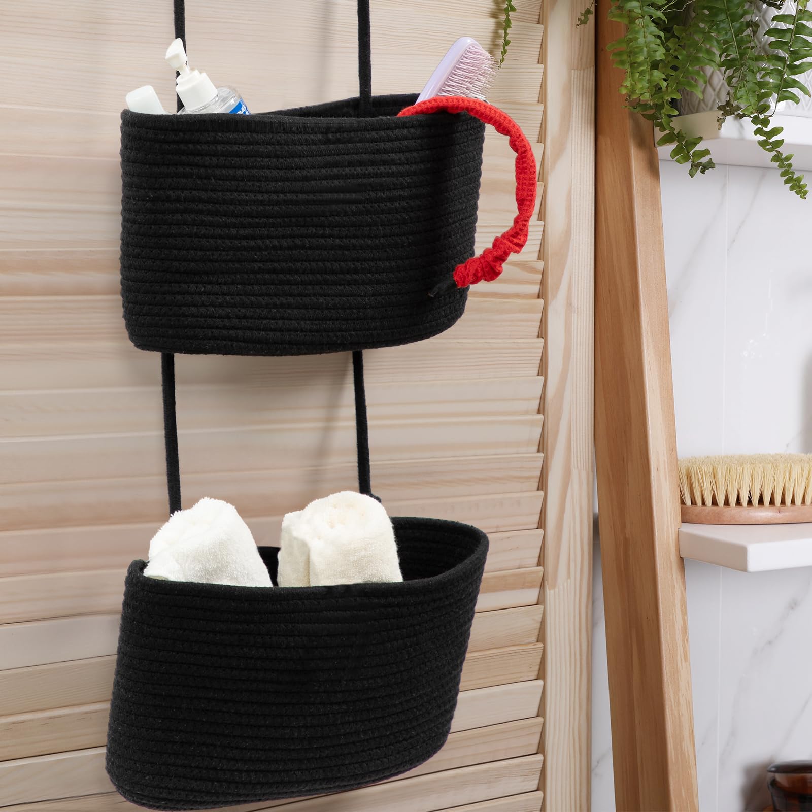 TeoKJ black decorative baskets housing dried flowers and small items.