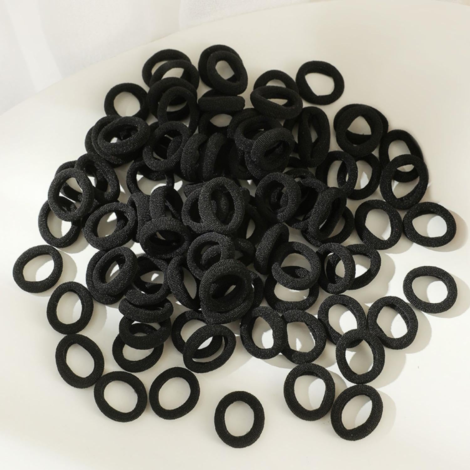 Tesvyns 0.85-inch hair bands, sturdy and stretchy for secure ponytails.