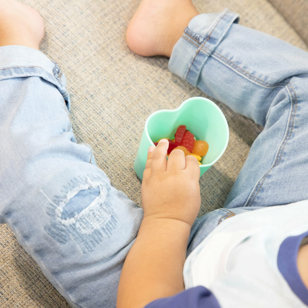 The First Years heart cup supports toddler sipping practice with a cute design.