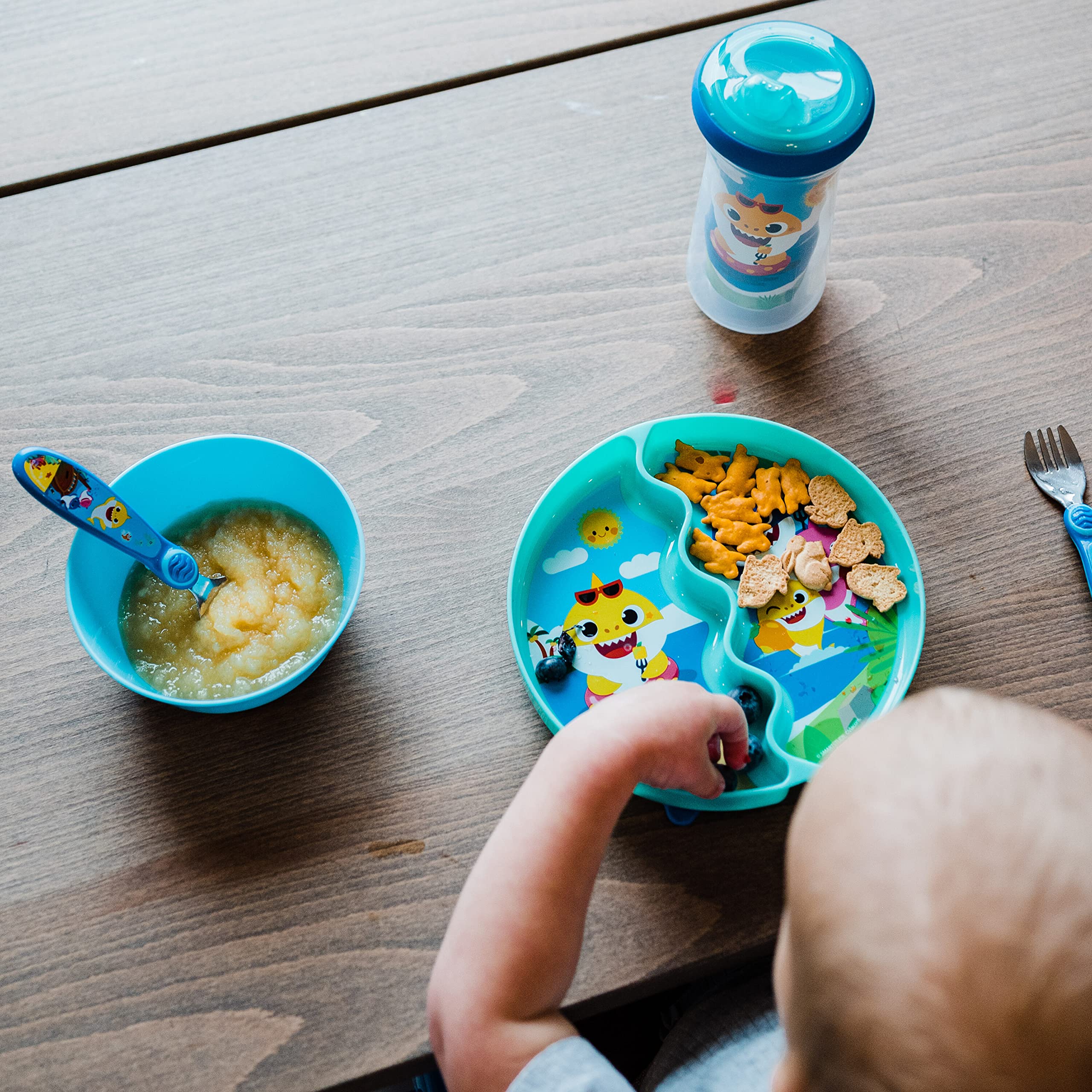 The First Years Pinkfong sippy cup valve close-up highlights leak prevention.