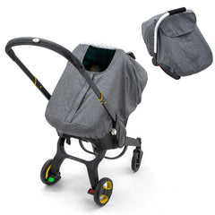 The KENKYO baby car seat cover waterproof exterior with plush dots lining shields against rain and wind.