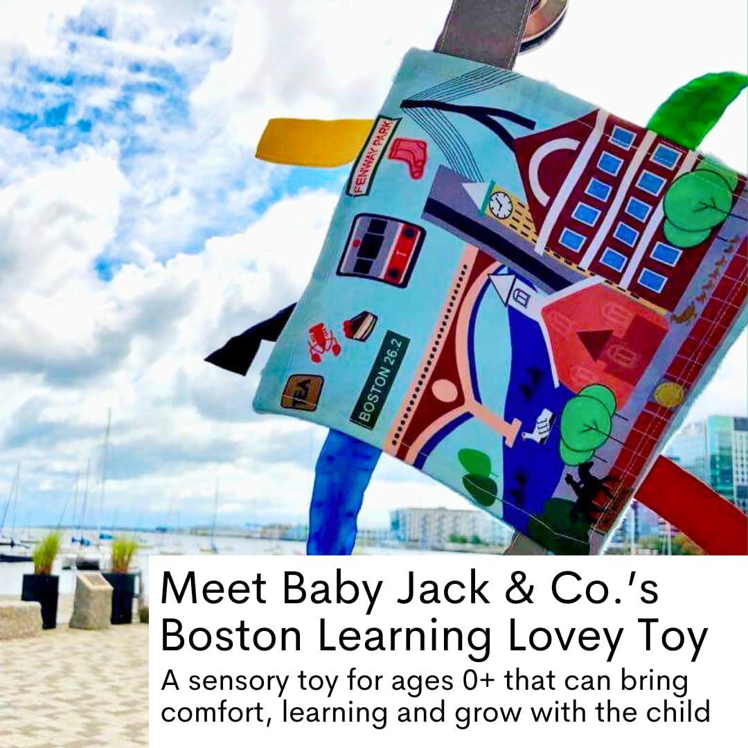 The Learning Lovey tag toy attached to a stroller clip demonstrates easy on-the-go play.