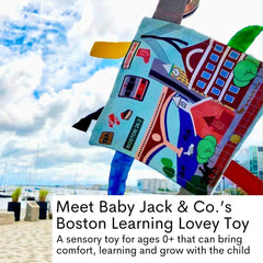 The Learning Lovey tag toy attached to a stroller clip demonstrates easy on-the-go play.