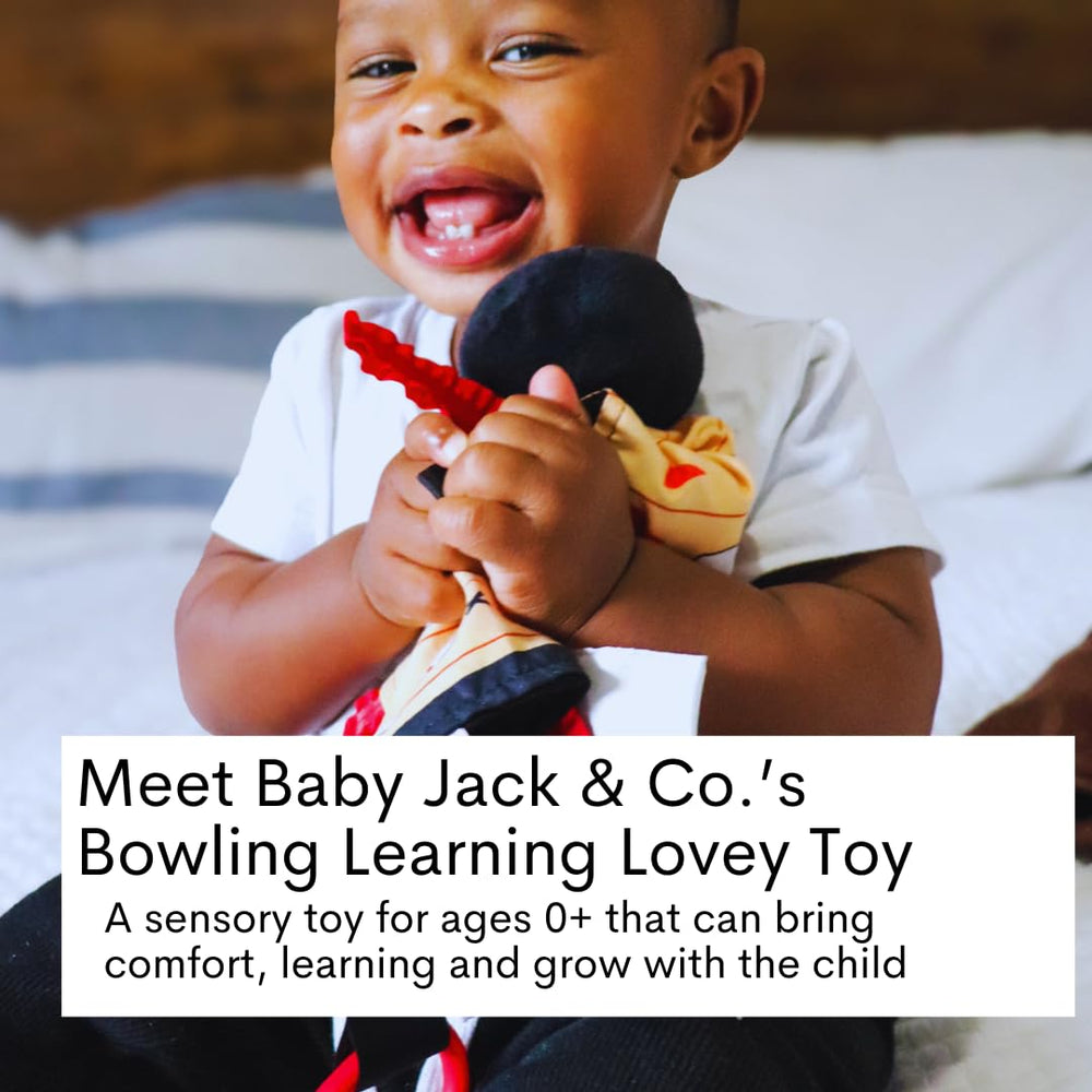 The Learning Lovey sensory plush blanket on stroller demonstrates on-the-go learning and soothing play