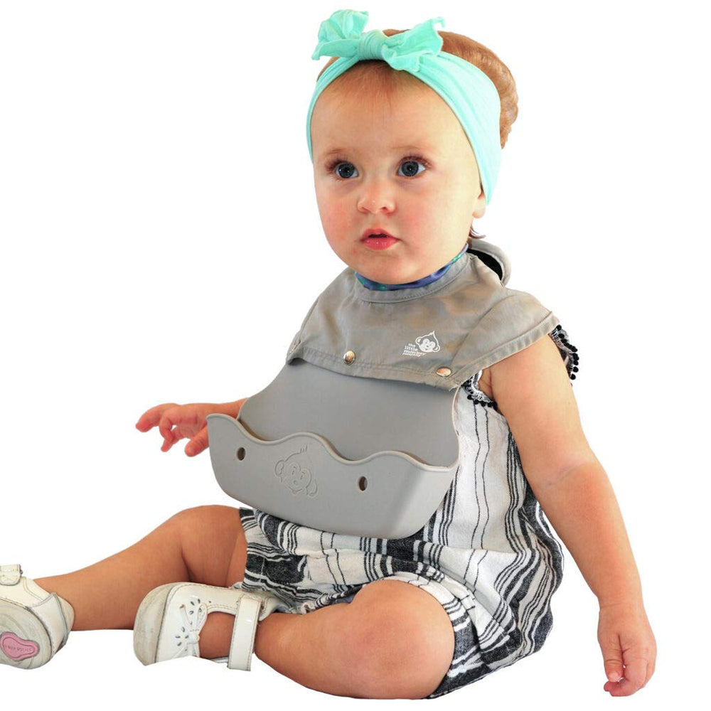 The Little Monkey Company Freddie Bib silicone catcher in action for quick cleanup after meals.