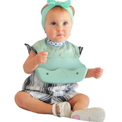 The Little Monkey Company silicone bib with wide crumb catcher reduces mess during meals